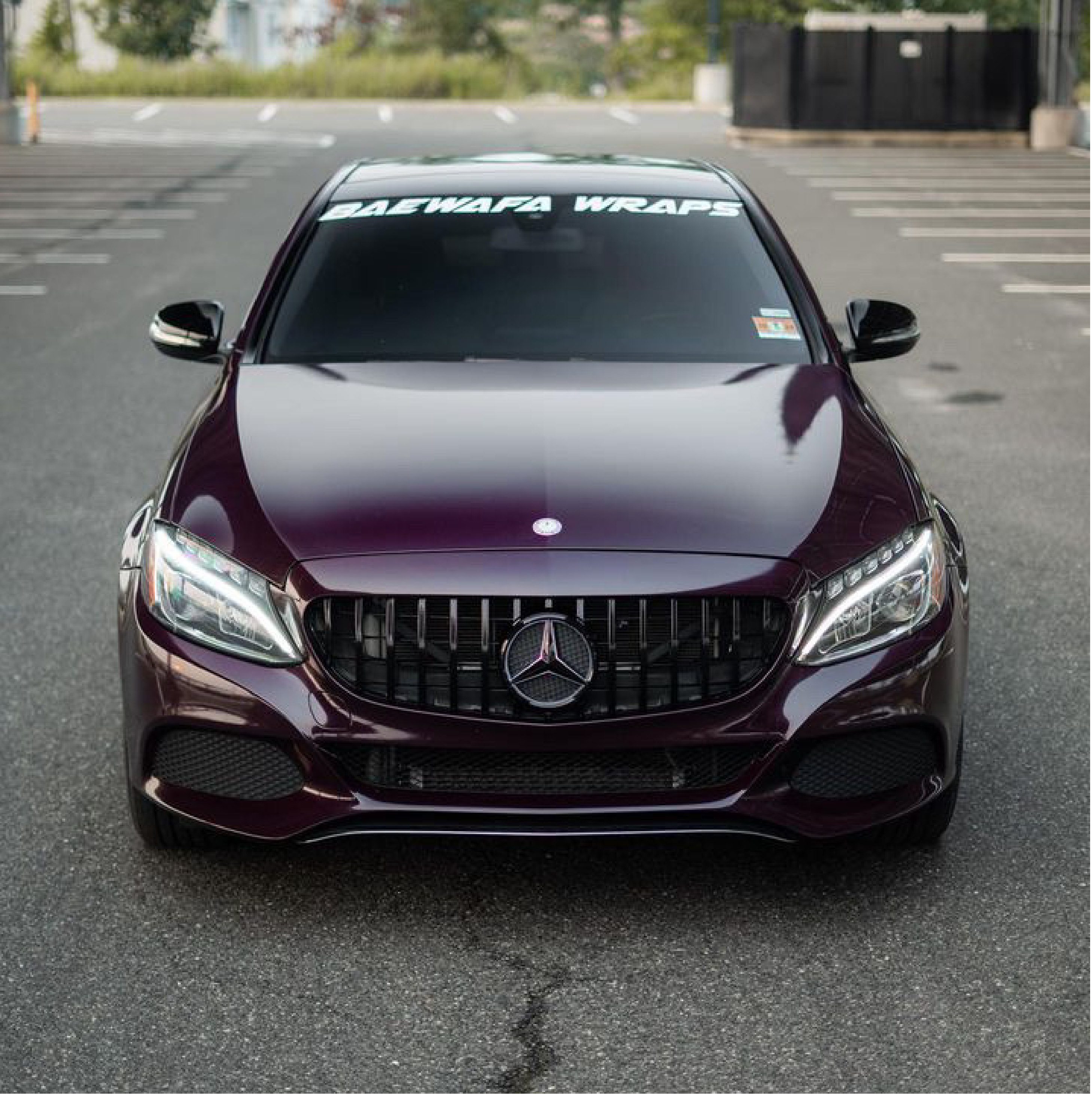 Gloss Black Rose Vinyl Car Wrap applied to vehicle, showcasing deep black color with subtle rose undertones and a sleek high-gloss reflective finish