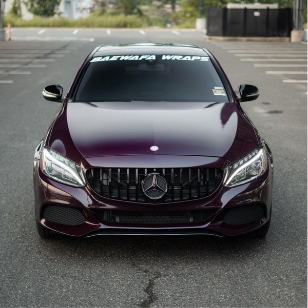 Gloss Black Rose Vinyl Car Wrap applied to vehicle, showcasing deep black color with subtle rose undertones and a sleek high-gloss reflective finish