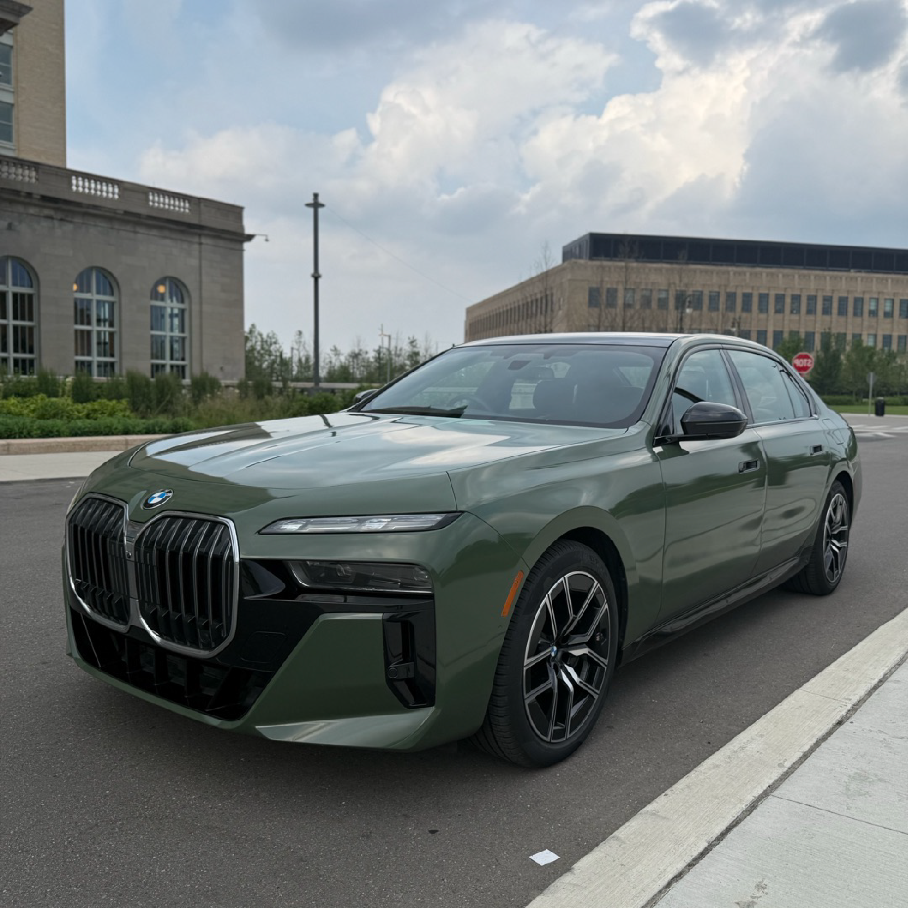 Gloss Military Green Vinyl Car Wrap applied to vehicle, showcasing rich army green color with a smooth, high-gloss finish and reflective surface