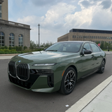 Gloss Military Green Vinyl Car Wrap applied to vehicle, showcasing rich army green color with a smooth, high-gloss finish and reflective surface