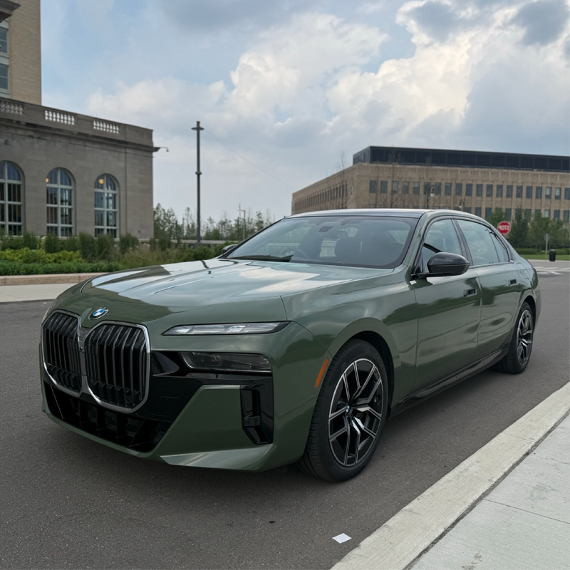Gloss Military Green Vinyl Car Wrap applied to vehicle, showcasing rich army green color with a smooth, high-gloss finish and reflective surface