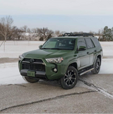 Gloss Military Green Vinyl Car Wrap applied to vehicle, showcasing rich army green color with a smooth, high-gloss finish and reflective surface