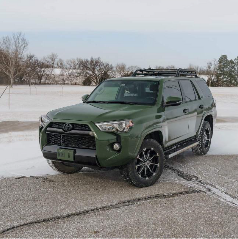 Gloss Military Green Vinyl Car Wrap applied to vehicle, showcasing rich army green color with a smooth, high-gloss finish and reflective surface